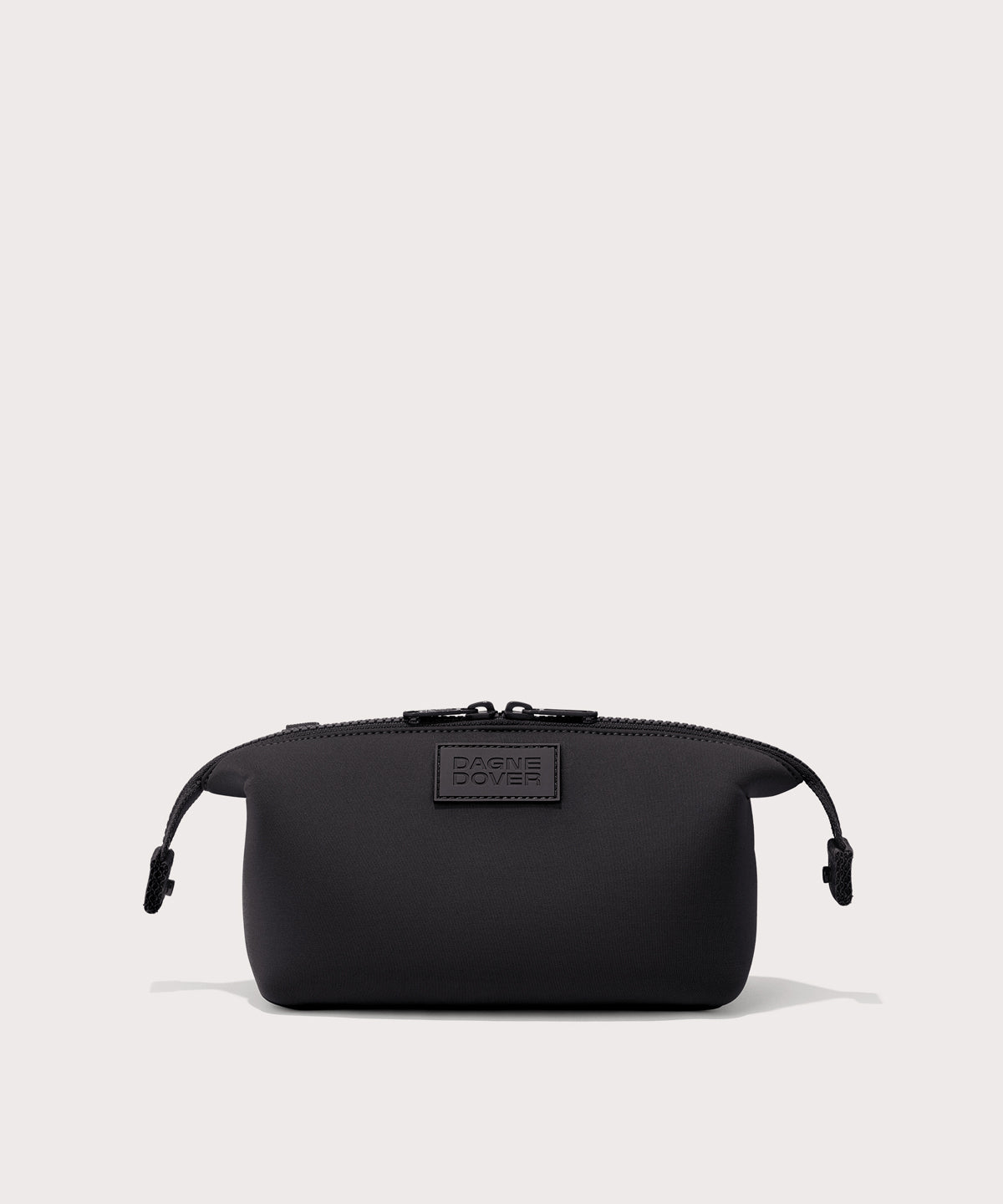Dagne Dover Small Hunter Toiletry Bag in black with sides unclipped.
