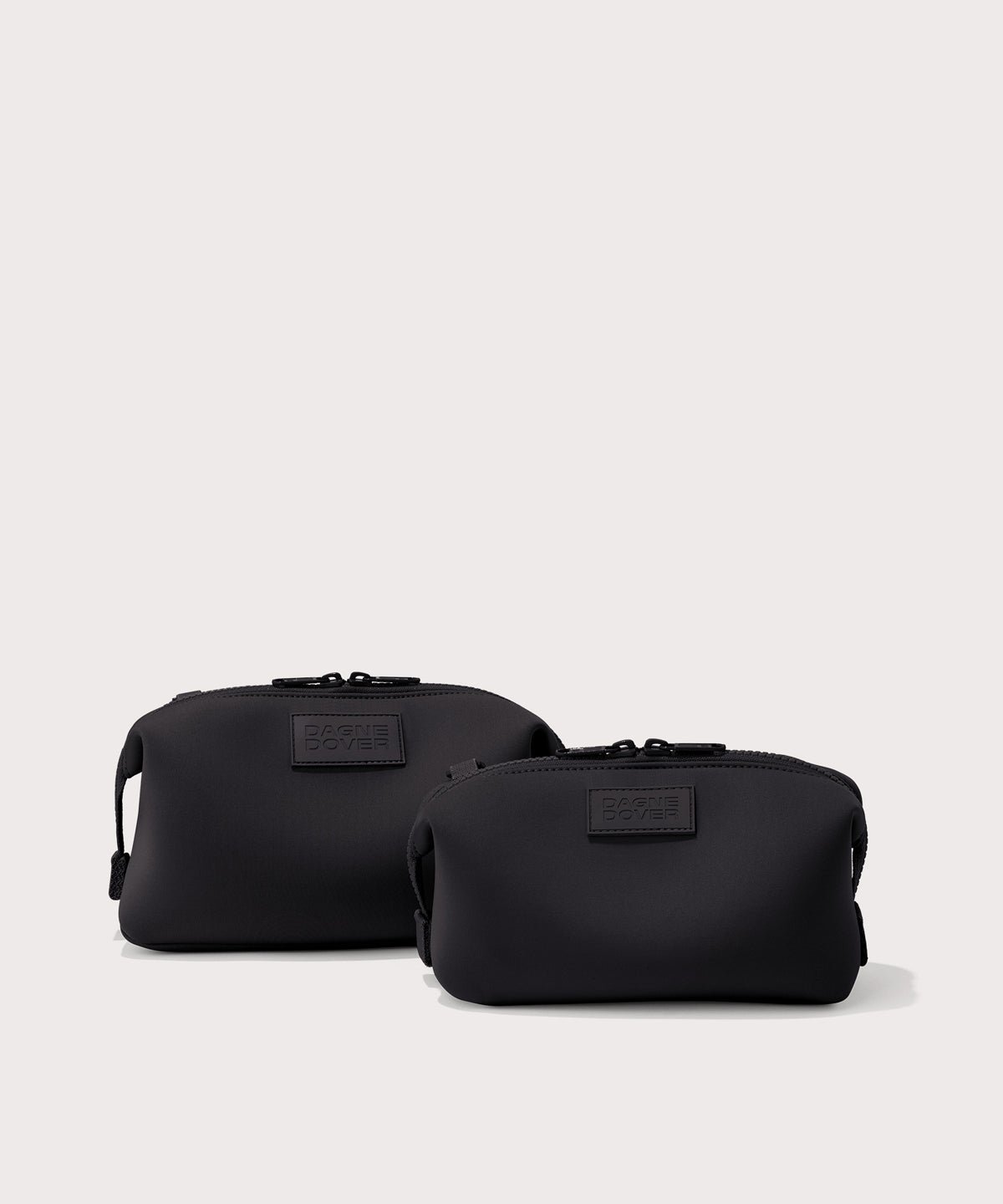 Dagne Dover Small and Large Hunter Toiletry Bags in black.
