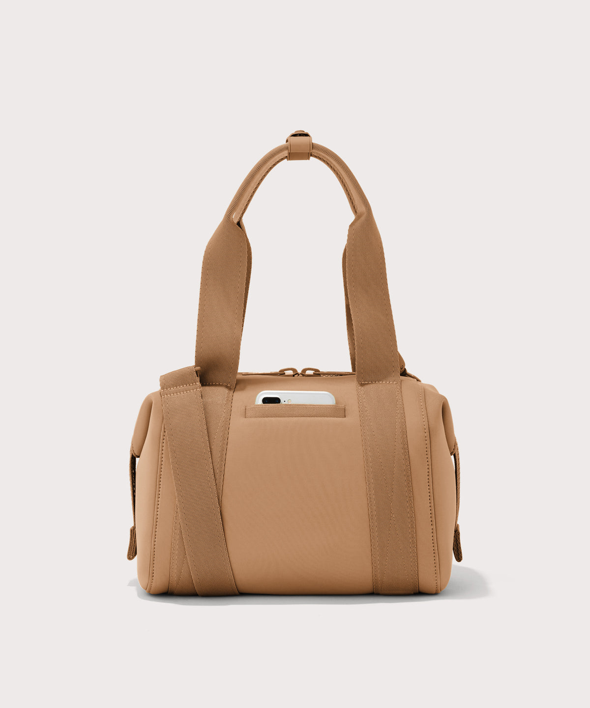 small Landon Carryall in brown camel, displaying an exterior phone pocket
