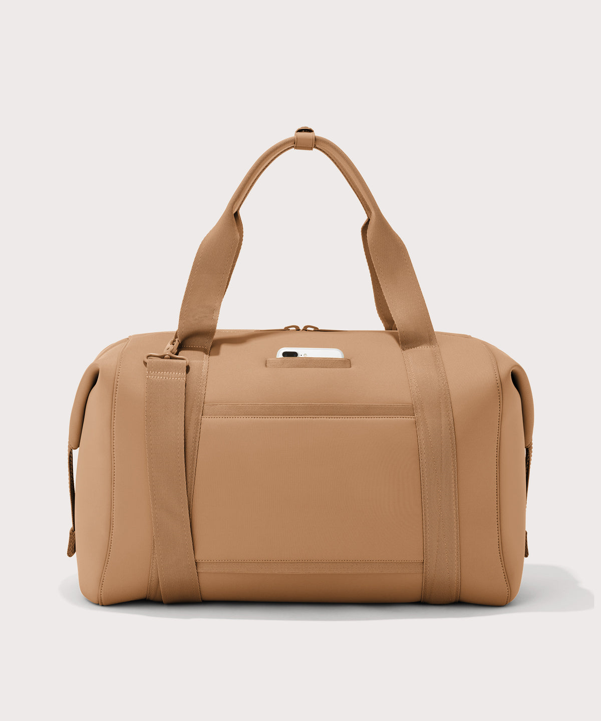 Extra large Landon Carryall in camel brown, displaying an exterior phone pocket
