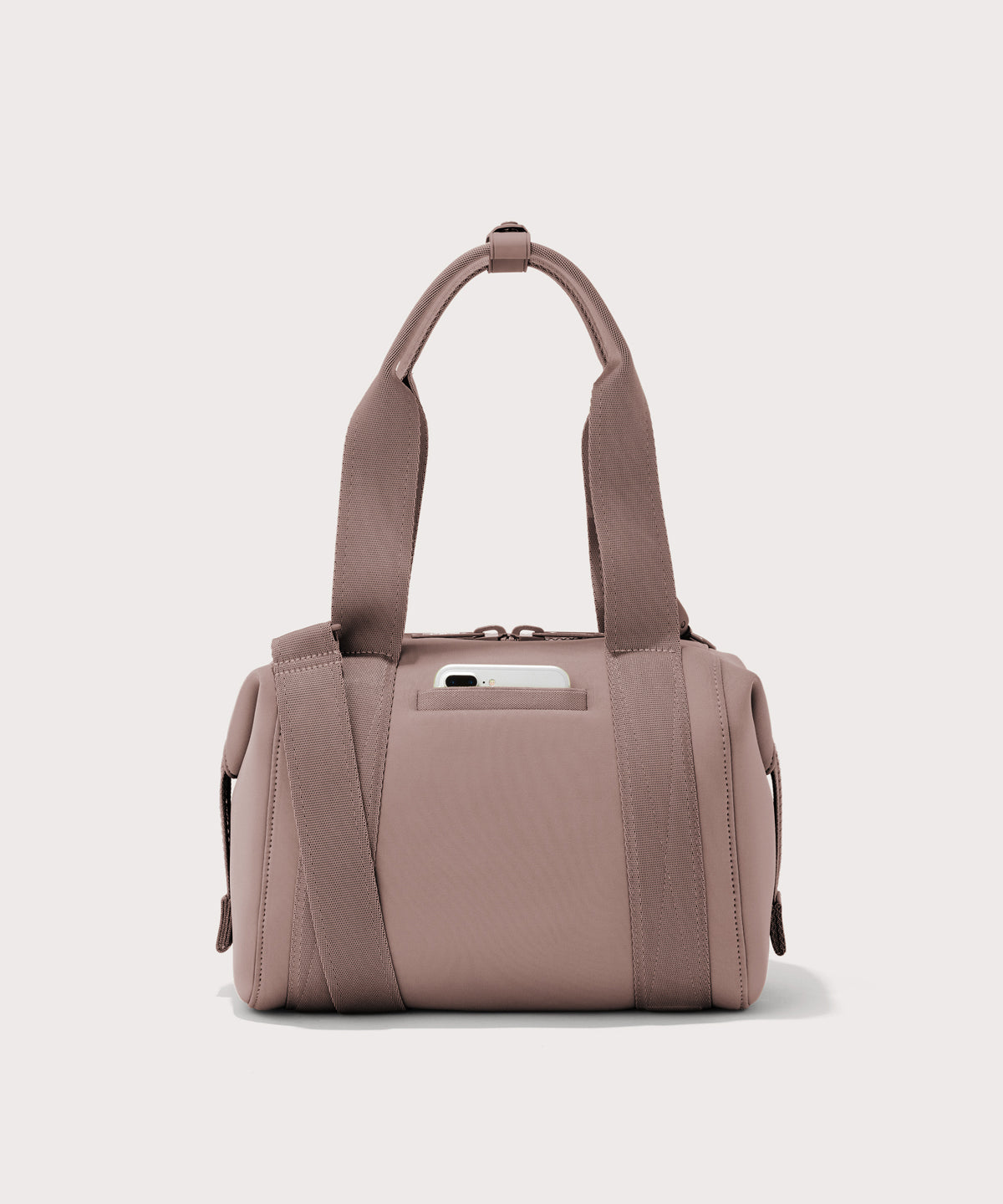 small Landon Carryall in pink, displaying an exterior phone pocket
