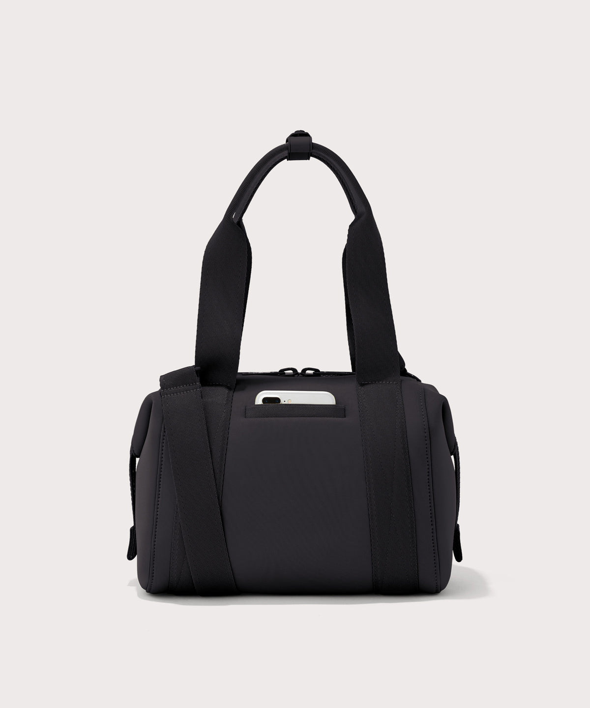 small Landon Carryall in black, displaying an exterior phone pocket
