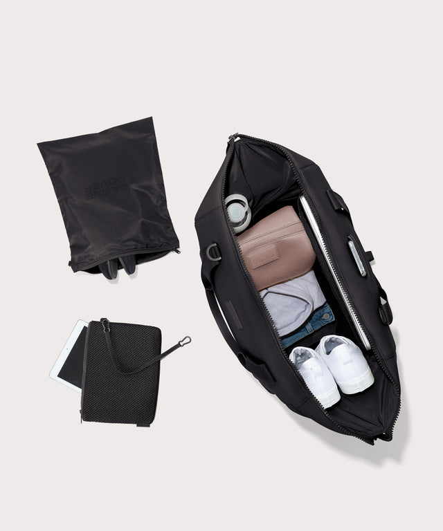 Extra large Landon Carryall in black unzipped, top down view. 
