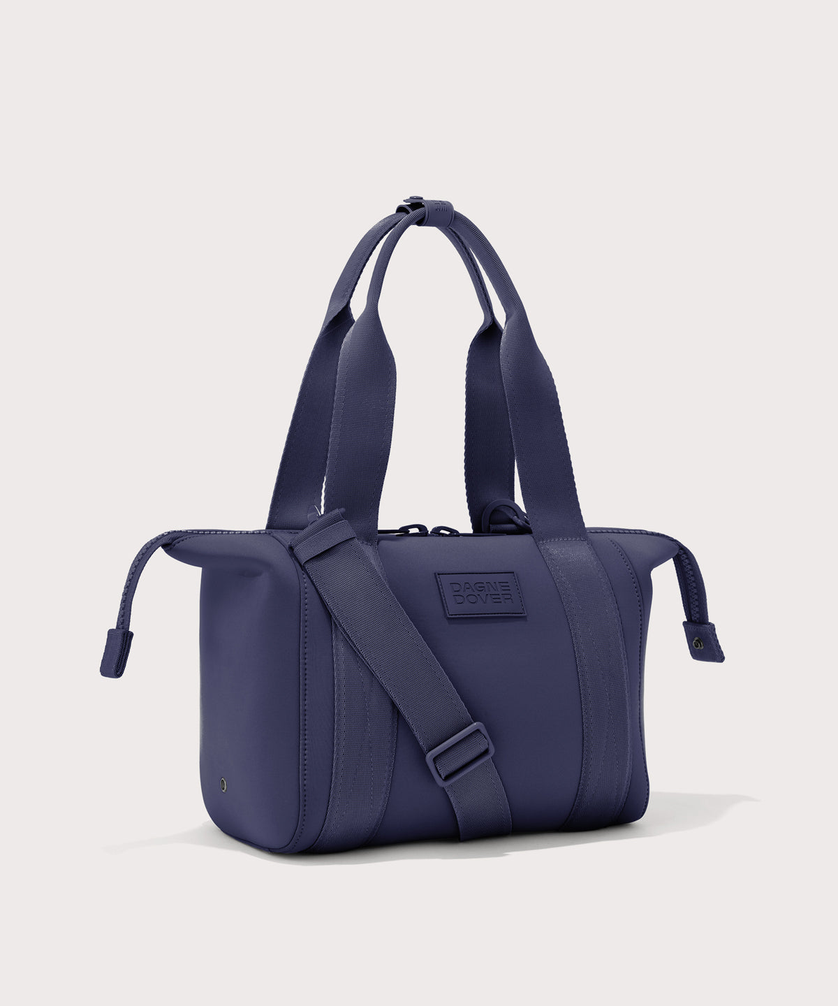 small Landon Carryall in dark blue with zippers unbuckled
