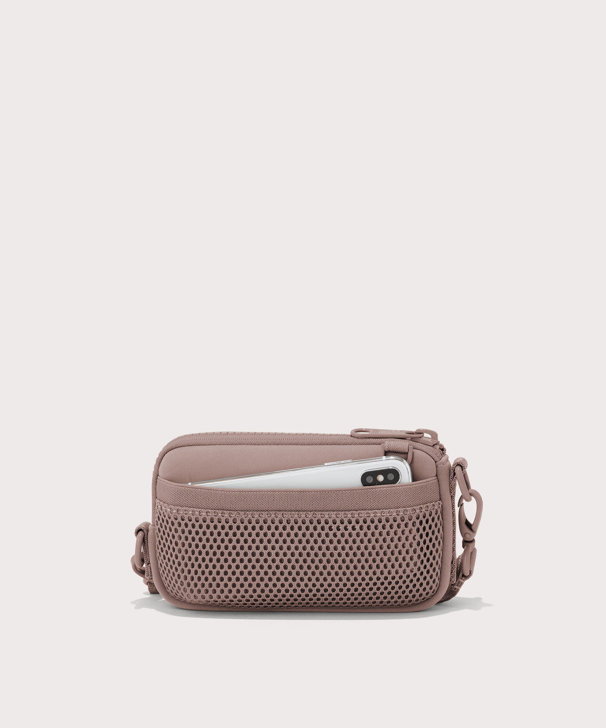 Dagne Dover Mara Phone Sling in pink showing the exterior air mesh slip.
