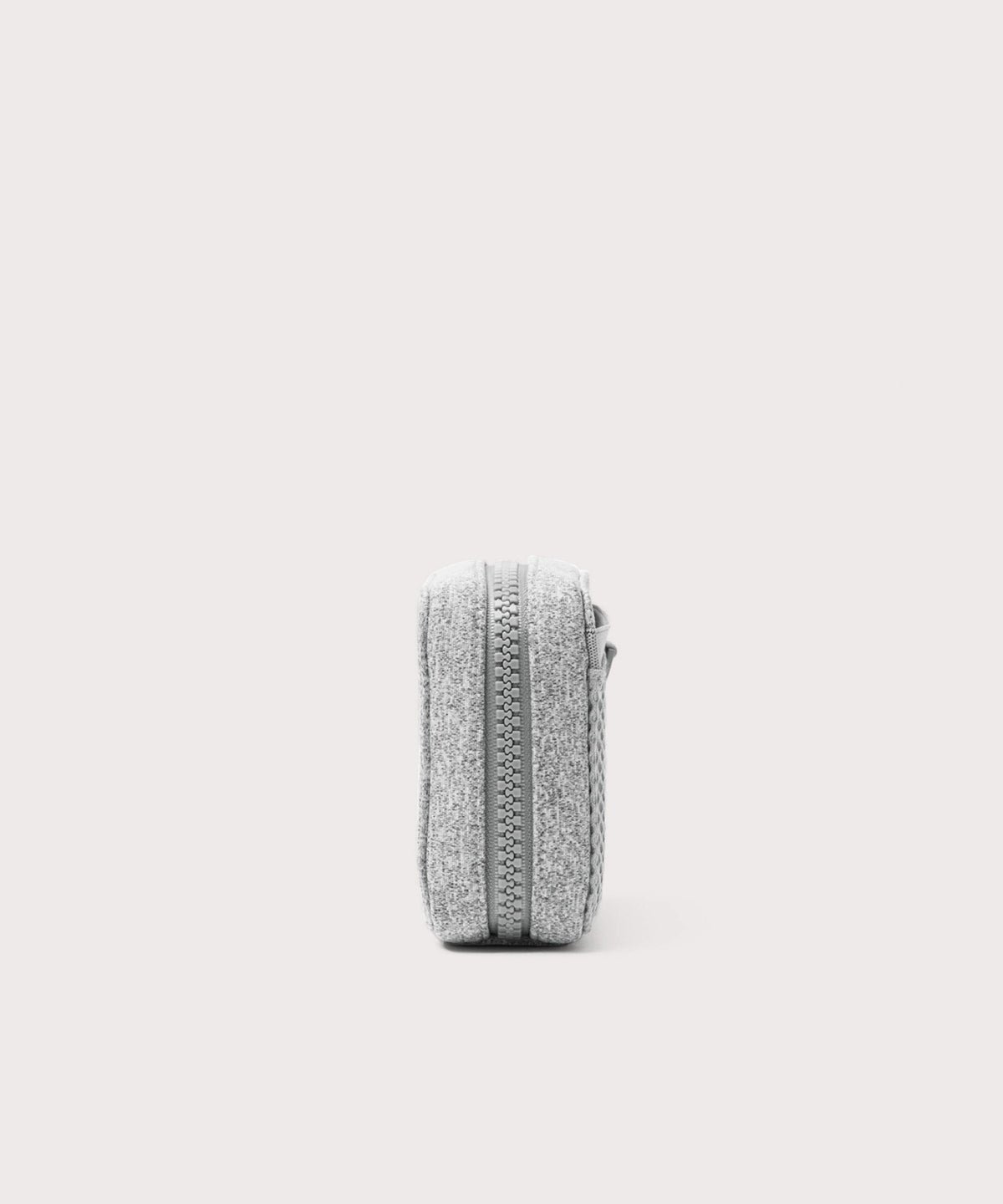 Dagne Dover small Arlo Tech Organizer in grey seen from the side.
