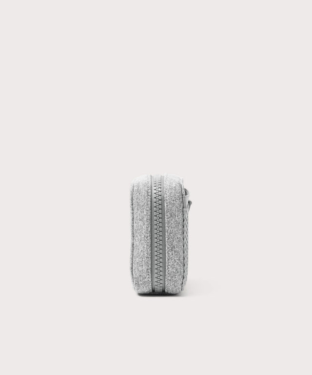 Dagne Dover small Arlo Tech Organizer in grey seen from the side.
