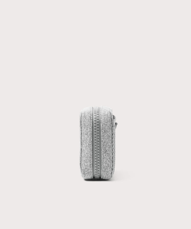 Dagne Dover small Arlo Tech Organizer in grey seen from the side.
