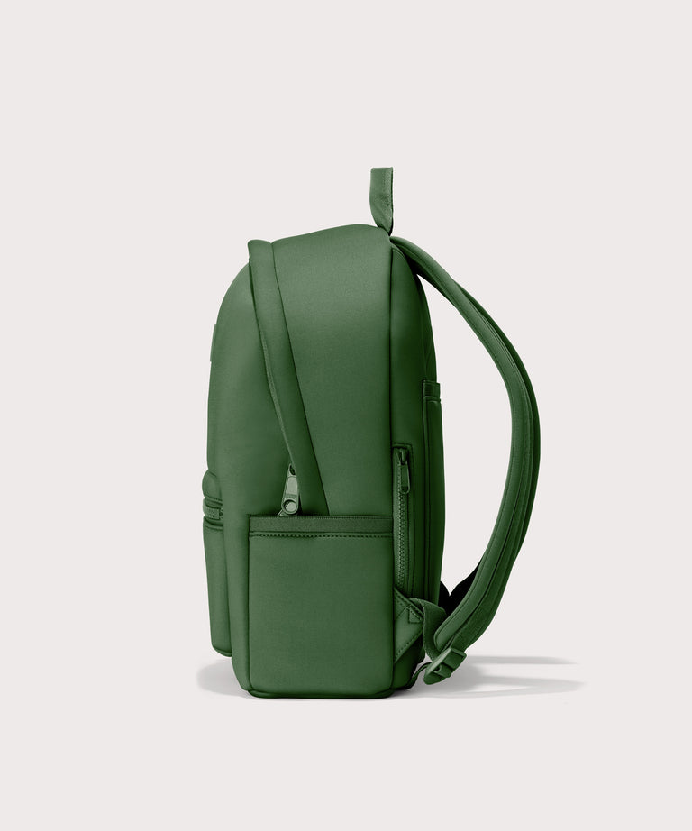 Dagne Dover medium Dakota Neoprene Backpack in a rich, classic forest green seen from the side.
