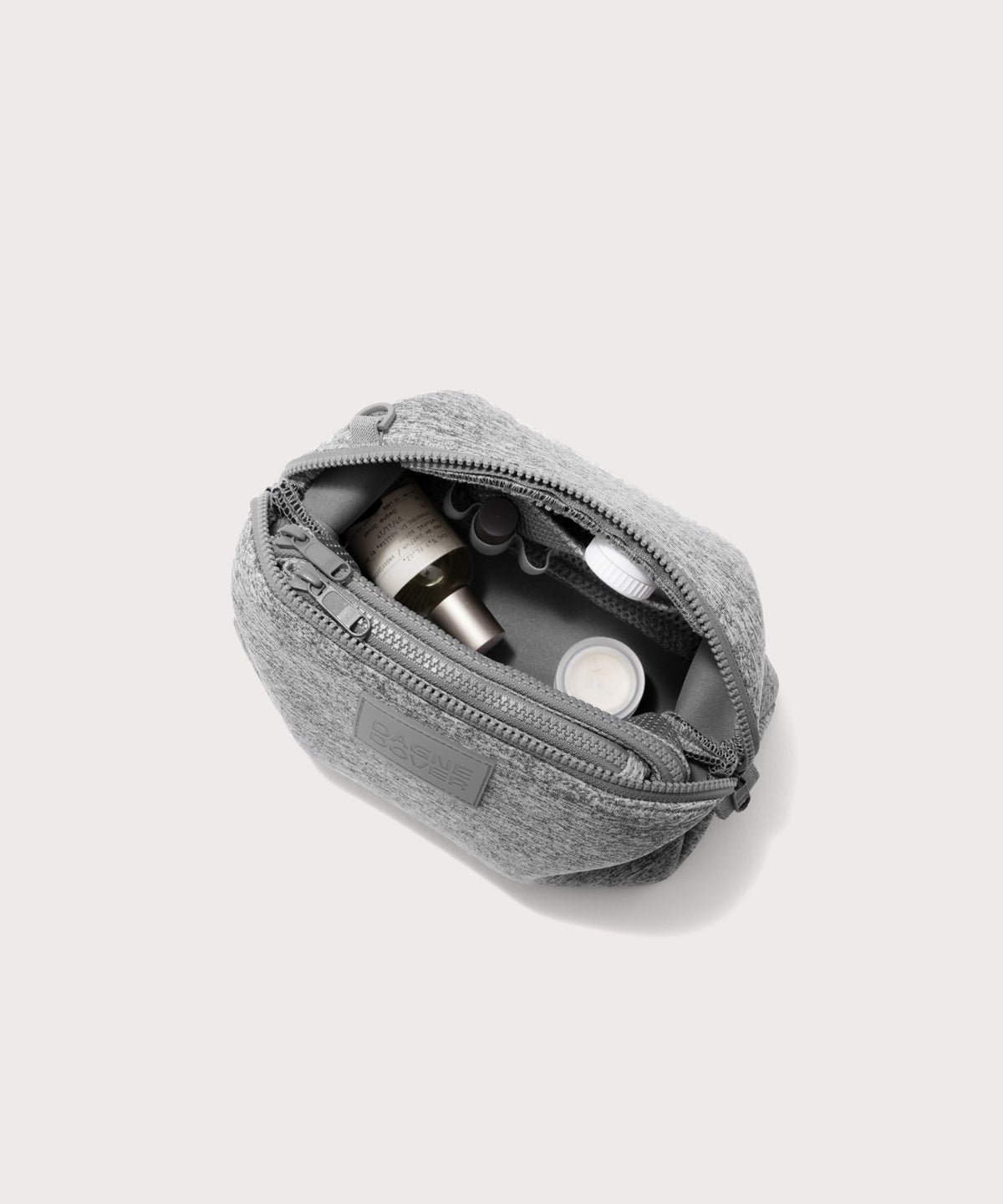 Dagne Dover Large Hunter Toiletry Bag in grey unzipped and seen from above.
