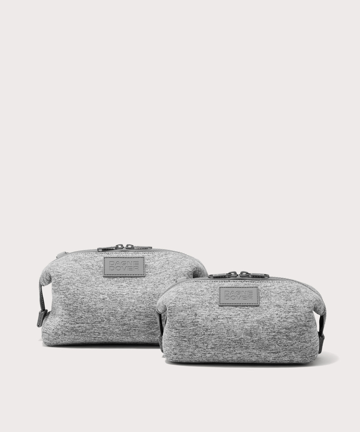 Dagne Dover Small and Large Hunter Toiletry Bags in grey.
