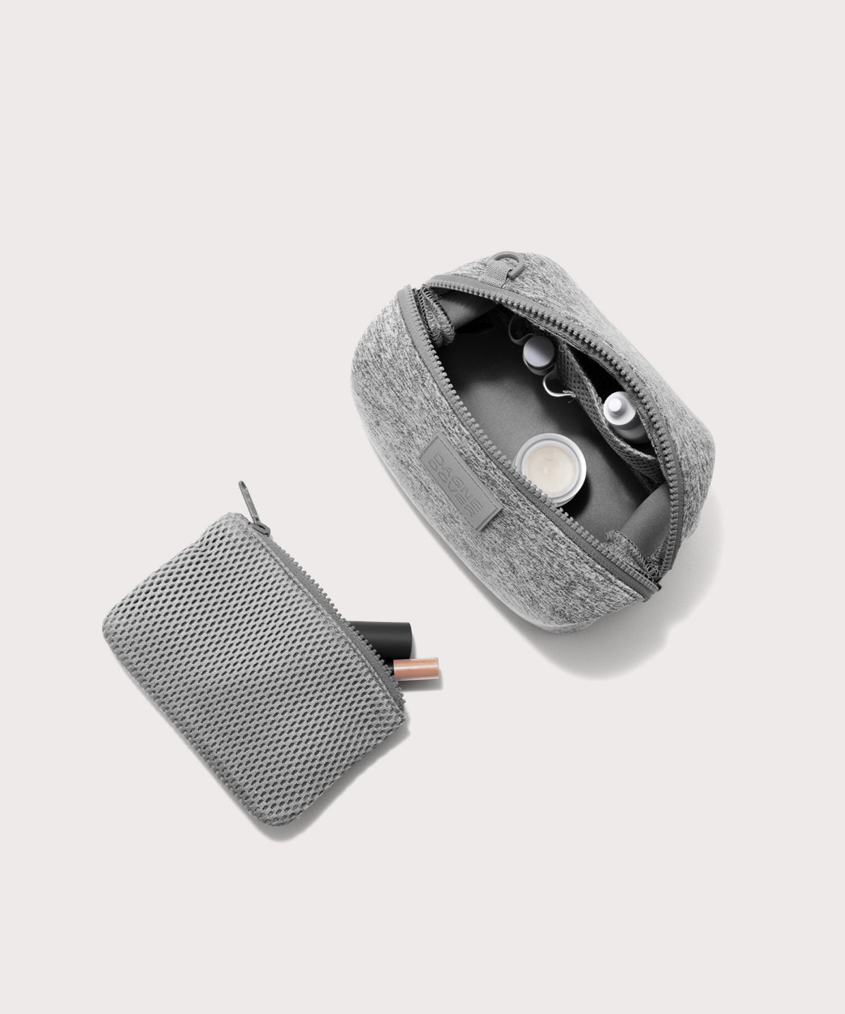 Dagne Dover Small Hunter Toiletry Bag in grey unzipped and seen from above with the removable air mesh pouch alongside it.