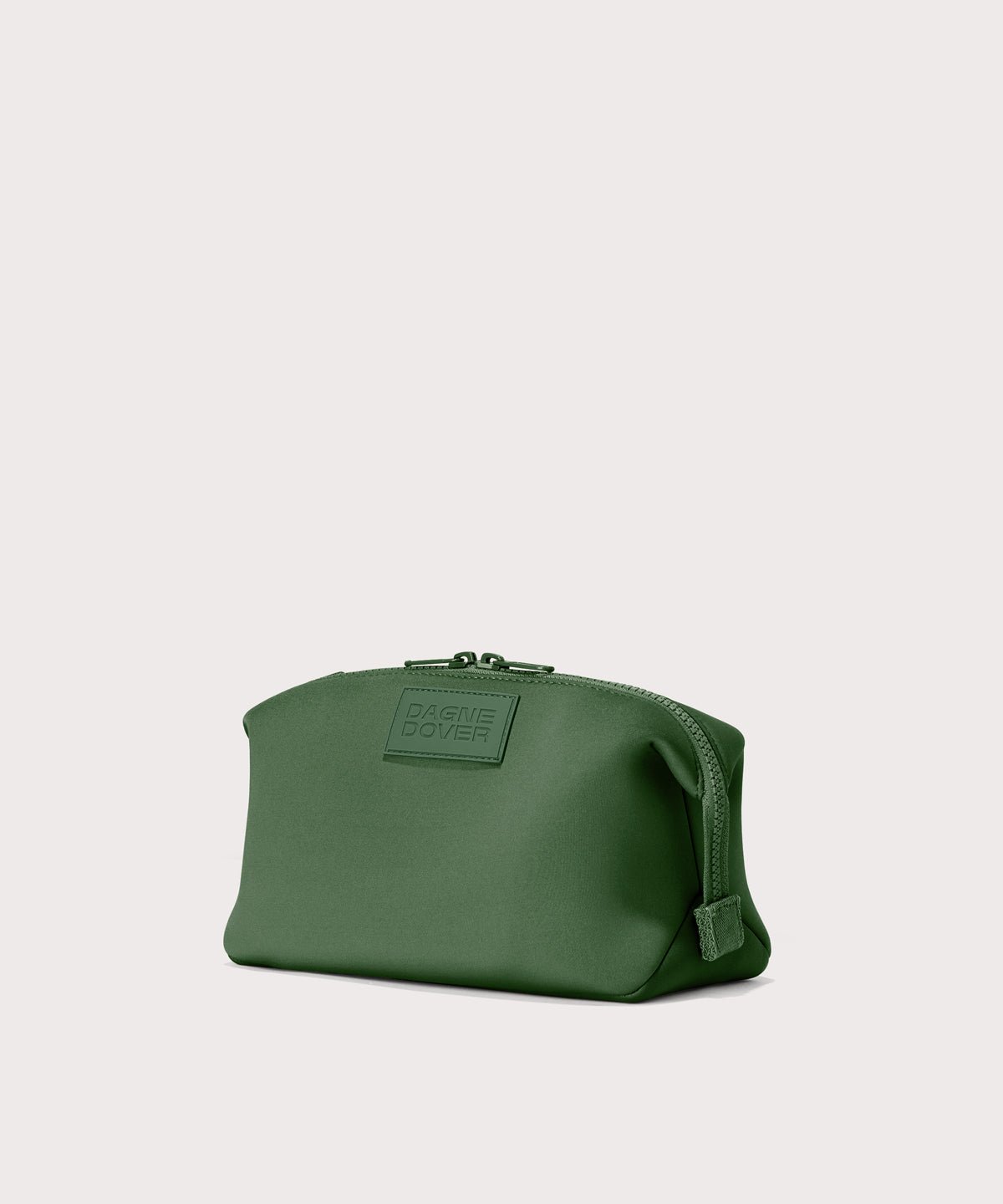 Dagne Dover large Hunter Toiletry Bag in a rich, classic forest green seen from an angle.
