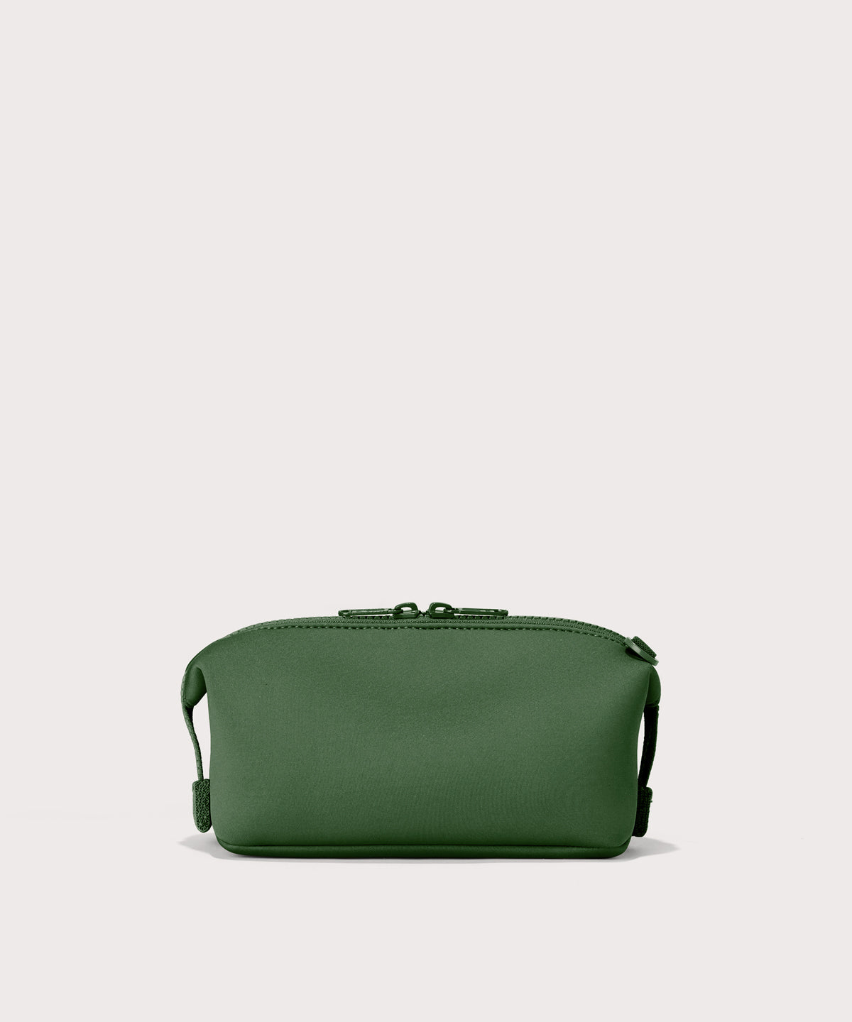 Dagne Dover Small Hunter Toiletry Bag in a rich, classic forest green seen from the back.
