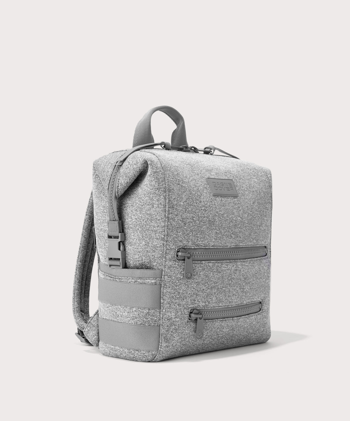 Dagne Dover medium Indi Diaper Backpack in grey seen from an angle.
