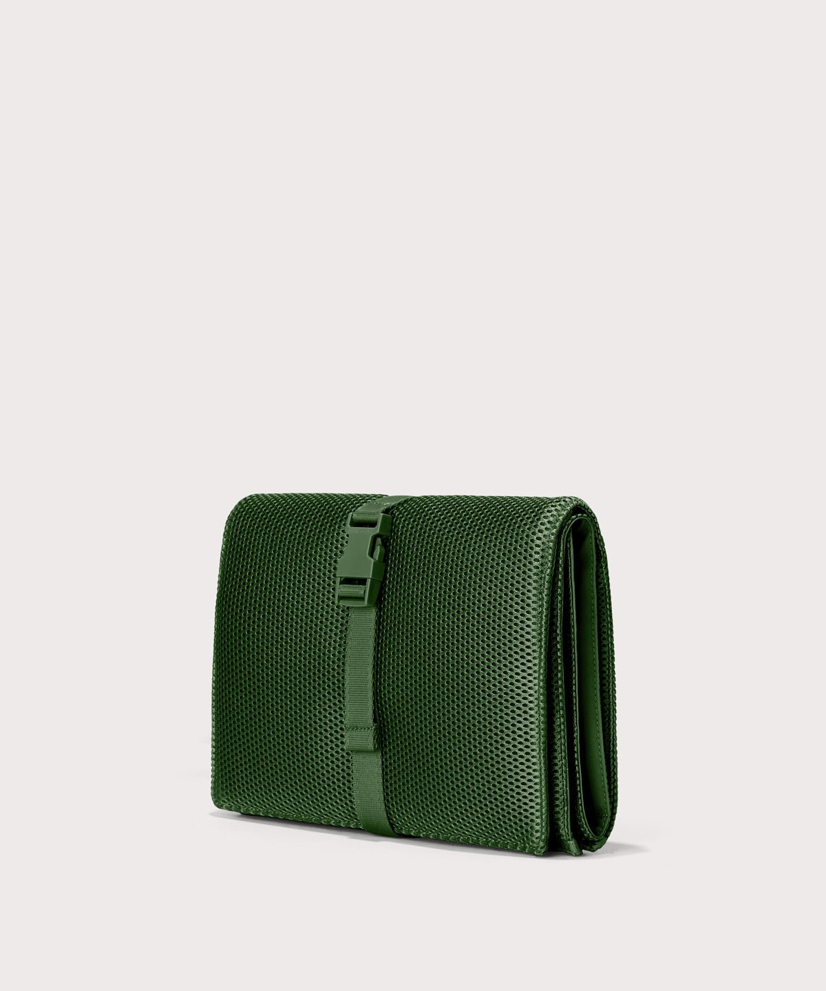 Dagne Dover Joey Changing Kit in a rich, classic forest green seen from an angle.
