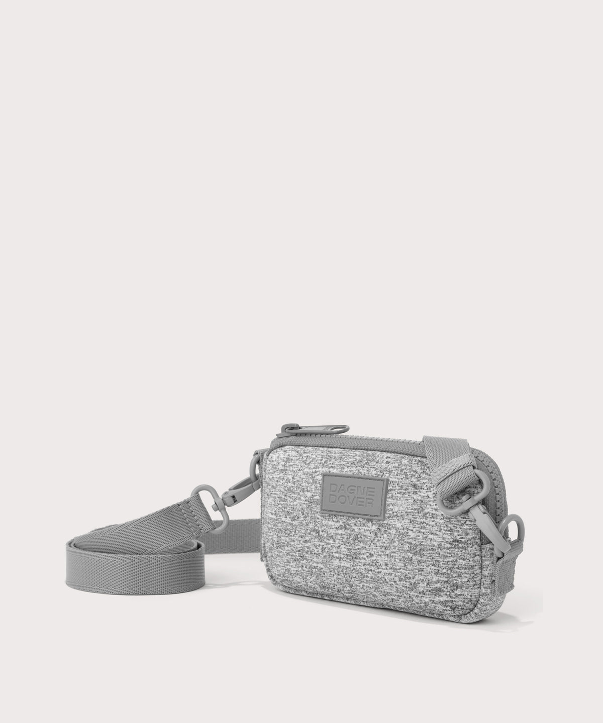 Dagne Dover Mara Phone Sling in grey seen from an angle, showing the adjustable shoulder strap drop.
