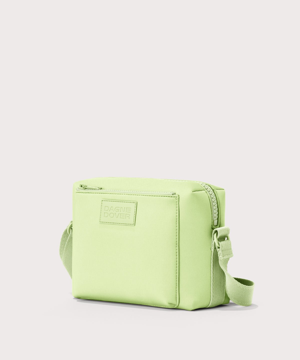 Dagne Dover Micah crossbody in matcha seen from an angle.
