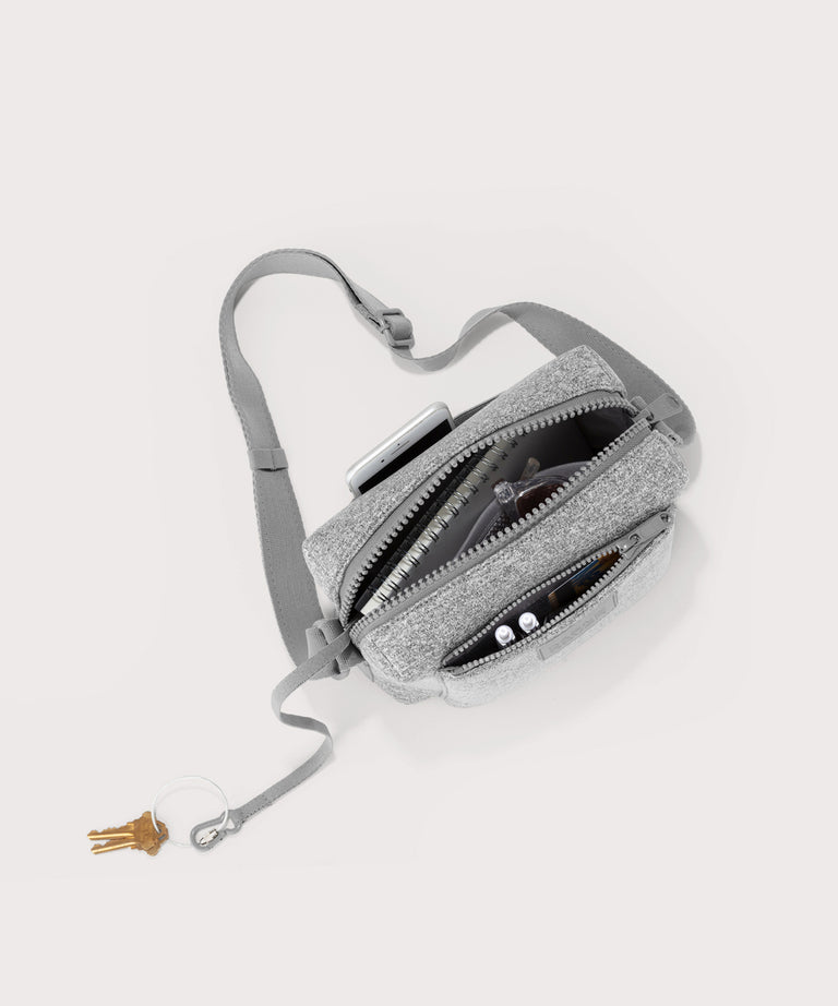 Dagne Dover Micah Crossbody in grey seen from above, showing the interior air mesh pocket.