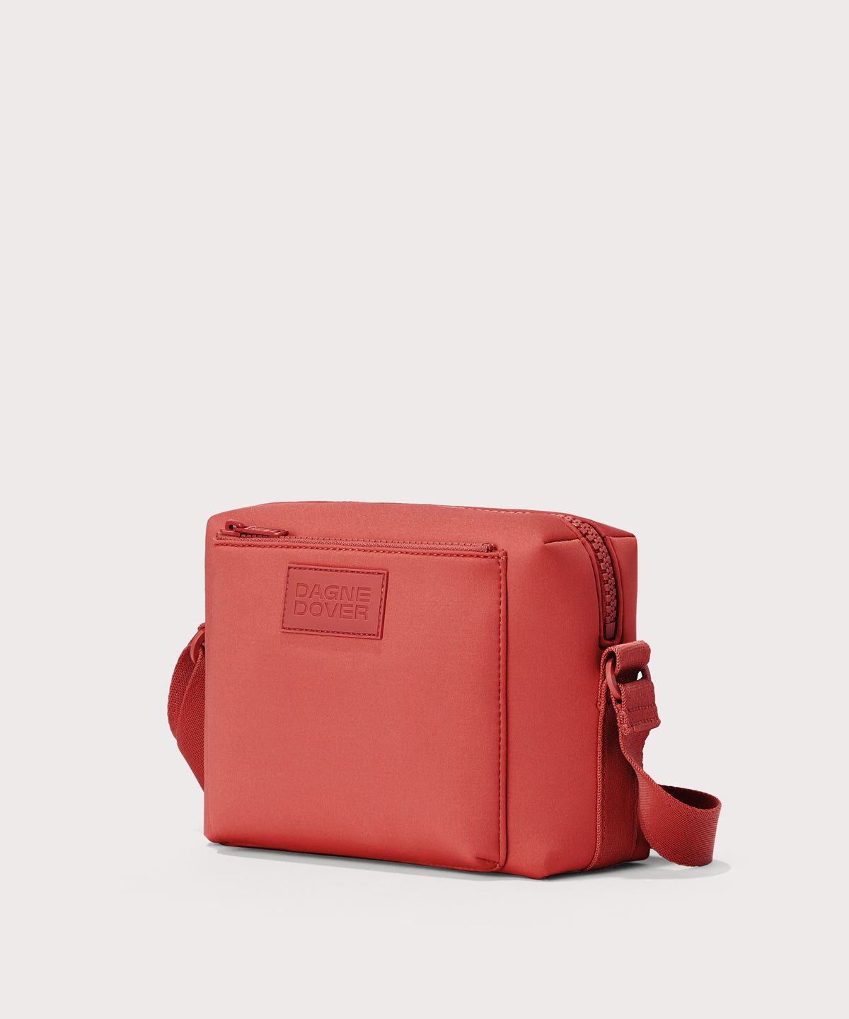 Dagne Dover Micah Crossbody in a poppy, vintage wash red seen without the adjustable shoulder strap.
