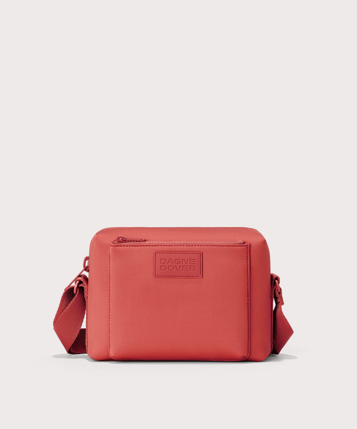 Dagne Dover Micah Crossbody in a poppy, vintage wash red.
