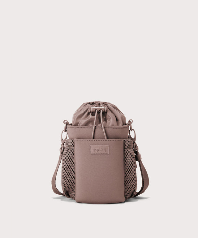 Dagne Dover Sloan Water Bottle Sling in pink.
