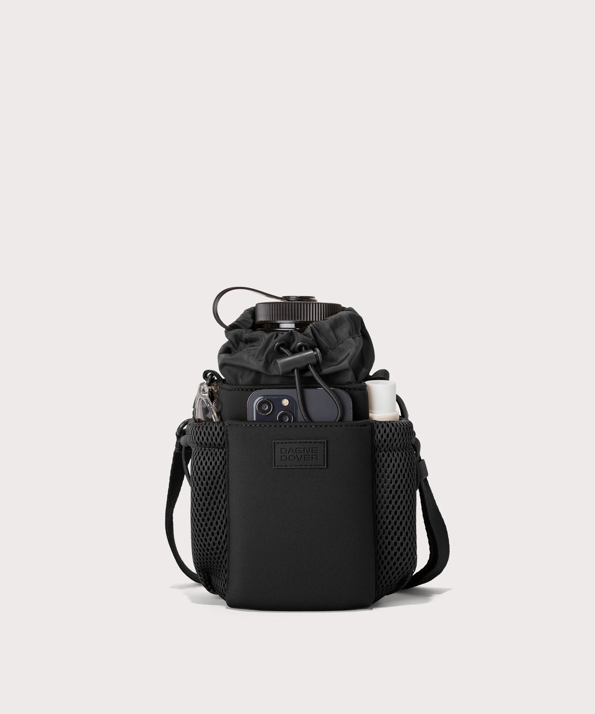 Dagne Dover Sloan Water Bottle Sling in black containing a water bottle and accessories.
