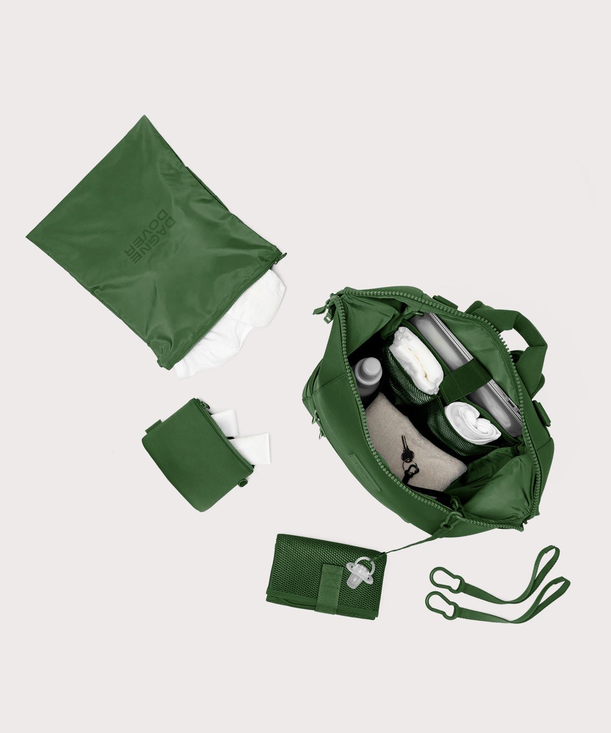Dagne Dover Large Indi Diaper Backpack in a rich, classic forest green showing it's water resistant bag, interior pockets, and changing mat.