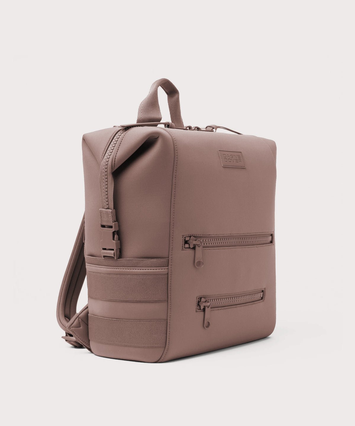Dagne Dover Large Indi Diaper Backpack in pink seen from an angle.
