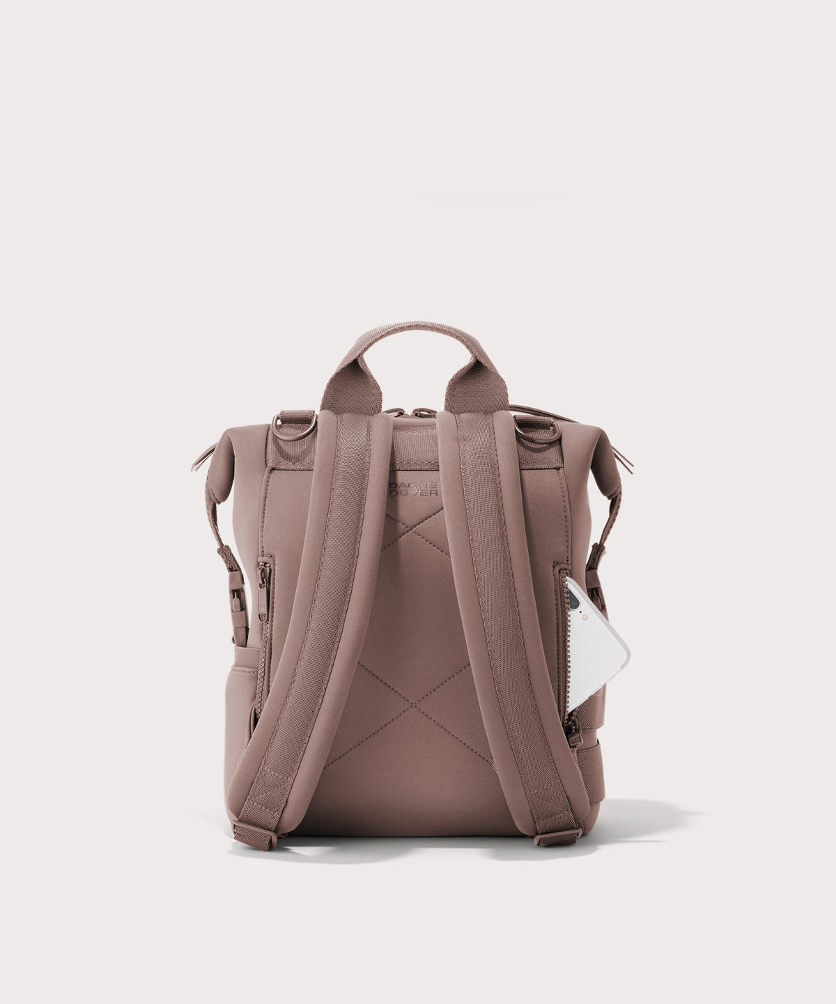 Dagne Dover small Indi Diaper Backpack in pink seen from the back.

