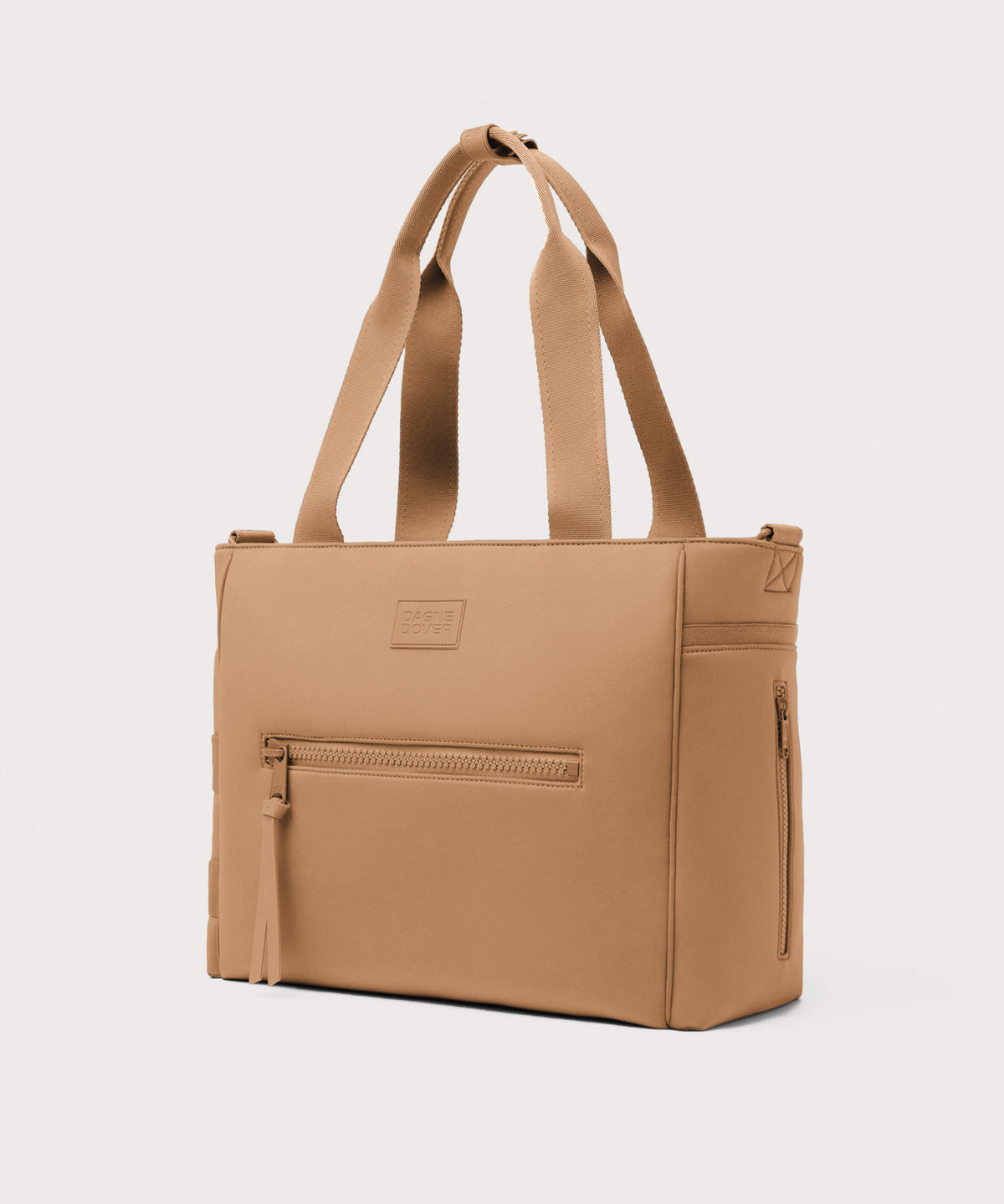 Dagne Dover large Wade Diaper Tote in camel brown seen from an angle.
