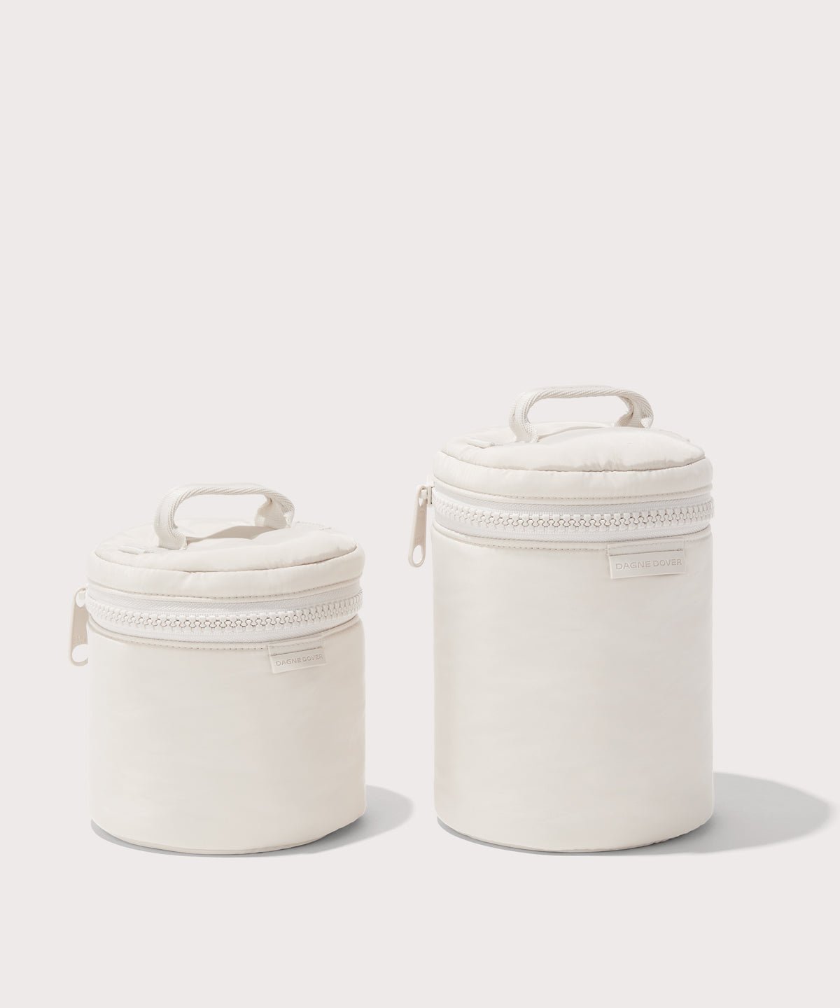 Dagne Dover small and large Mila Toiletry Pouches in white.