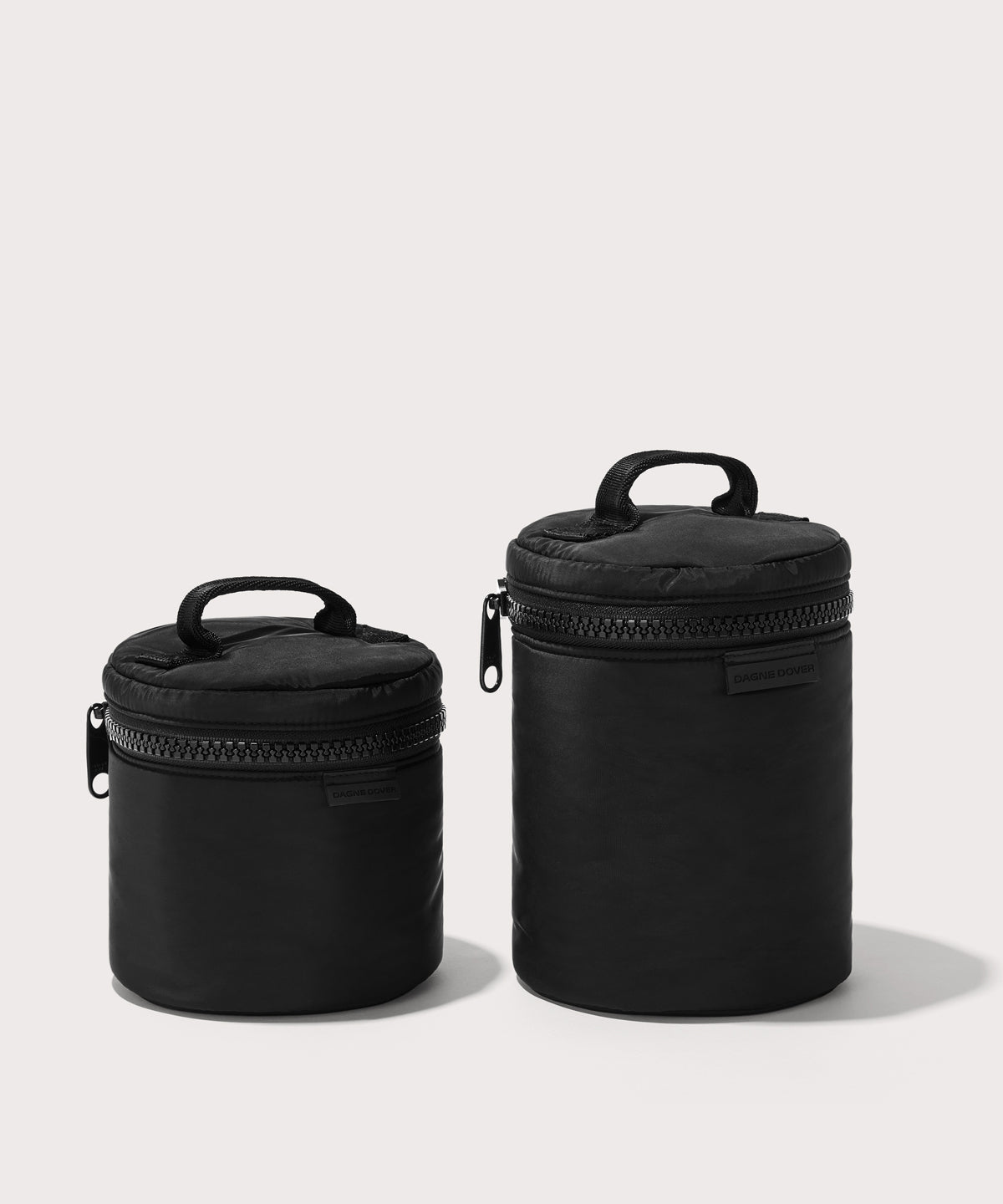 Dagne Dover small and large Mila Toiletry Pouches in black.
