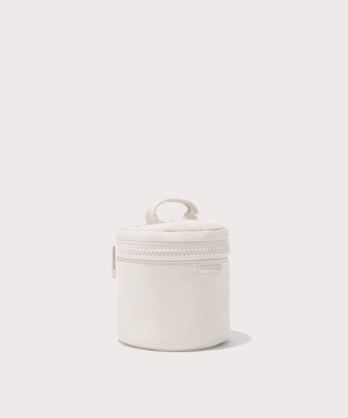 Dagne Dover small Mila Toiletry Pouch in white seen from an angle.
