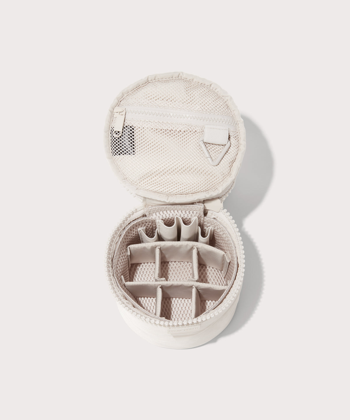 Dagne Dover small Mila Toiletry Pouch in white unzipped with the 6 adjustable compartments.
