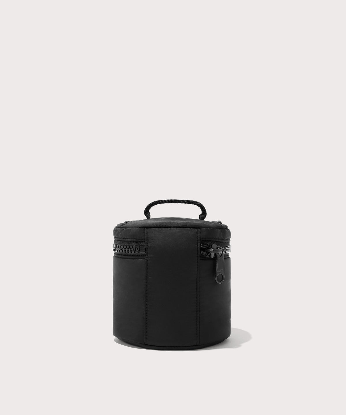 Dagne Dover small Mila Toiletry Pouch in black seen from the back.
