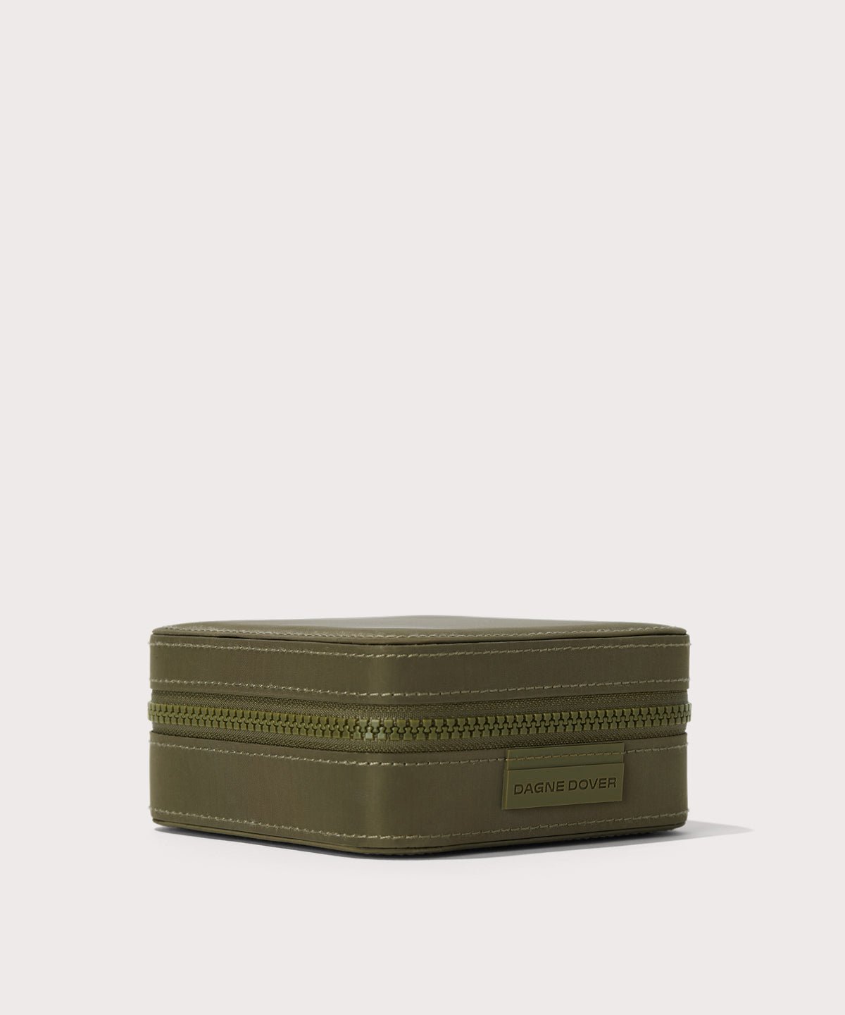 Dagne Dover Large Frankie Jewelry Case in dark green seen from the side.
