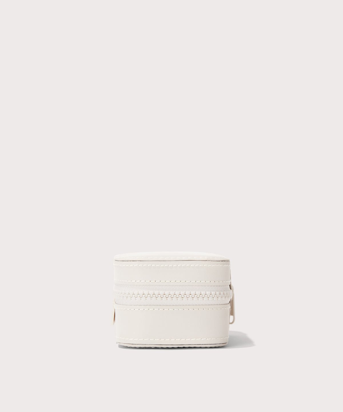 Dagne Dover small Frankie Jewelry Case in white seen from a side.
