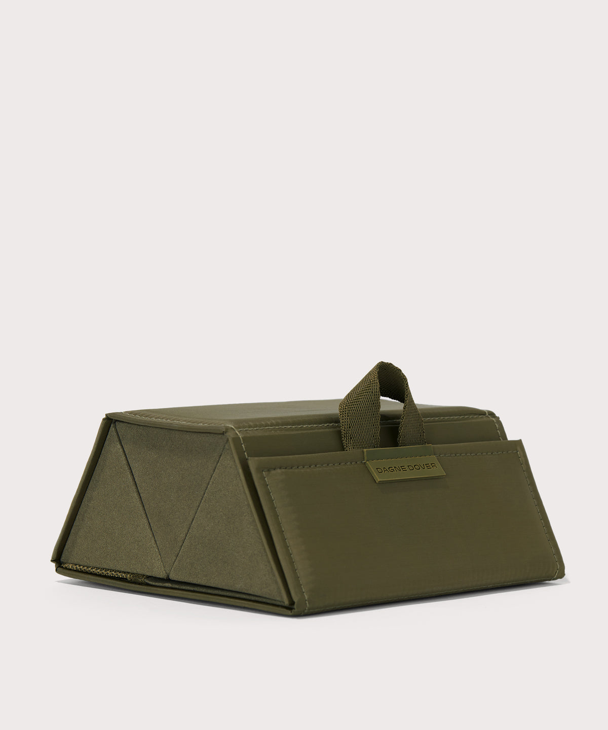 Dagne Dover Remi foldable glasses holder in dark green seen from an angle.
