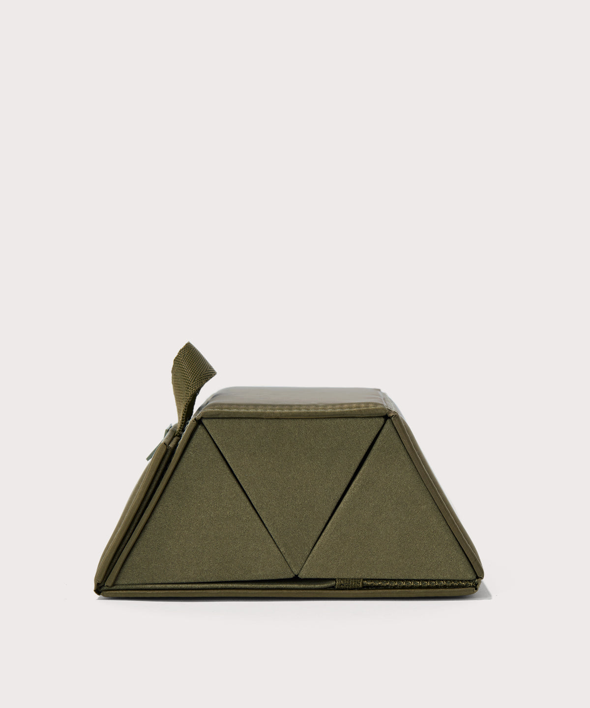 Dagne Dover Remi foldable glasses holder in dark green seen from the side.
