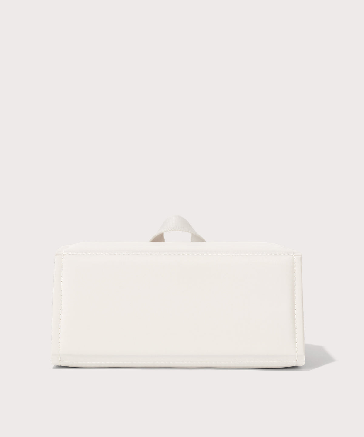 Dagne Dover Remi foldable glasses holder in white seen from the back.
