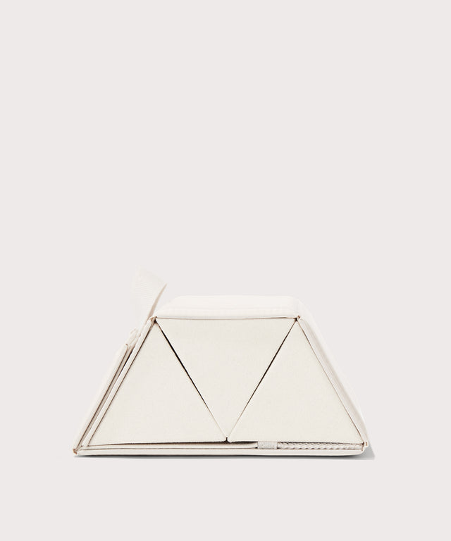 Dagne Dover Remi foldable glasses holder in white seen from the side.

