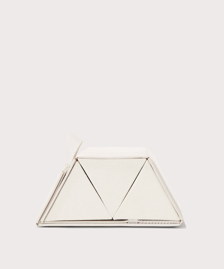Dagne Dover Remi foldable glasses holder in white seen from the side.

