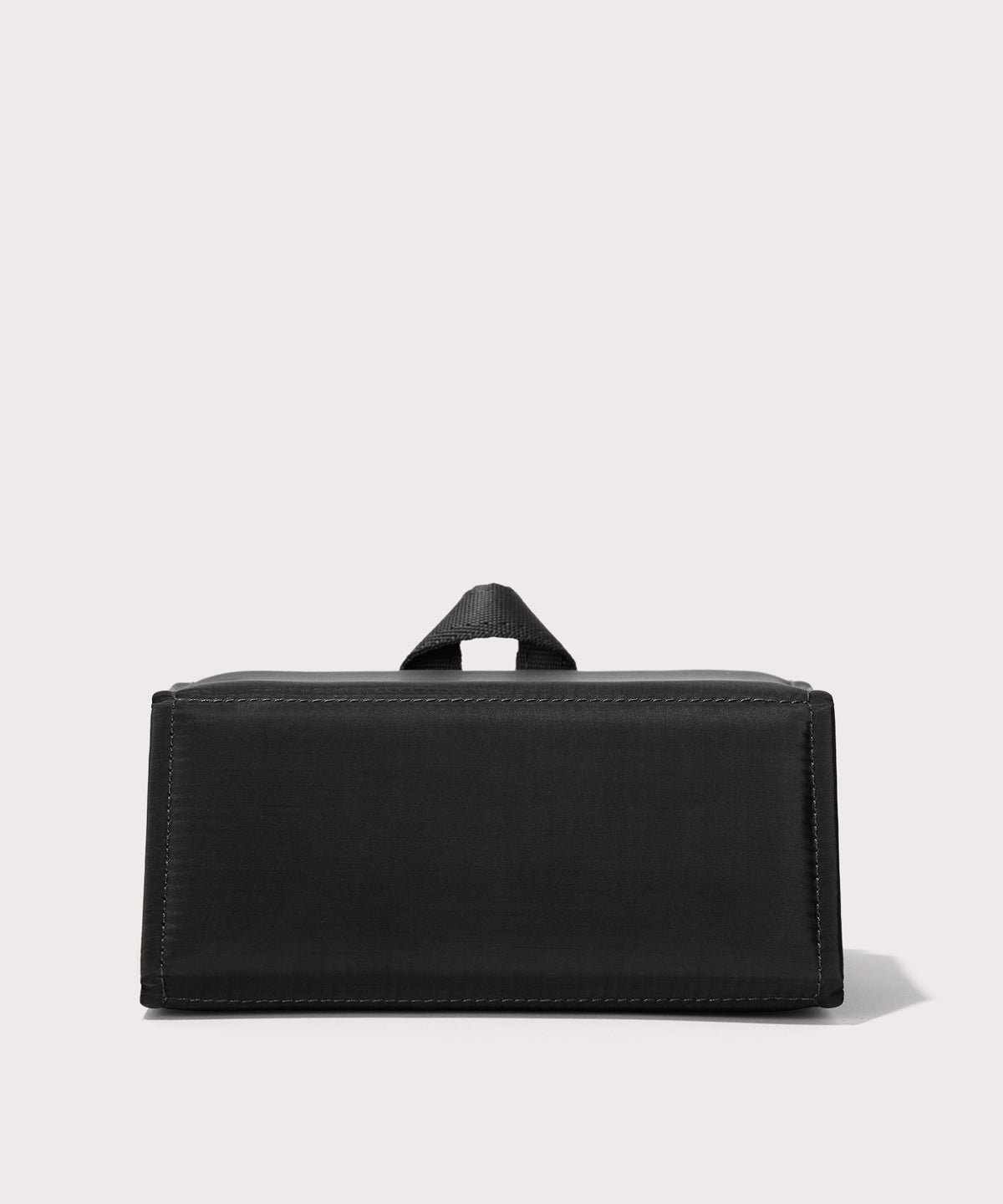 Dagne Dover Remi foldable glasses holder in black seen from the back.

