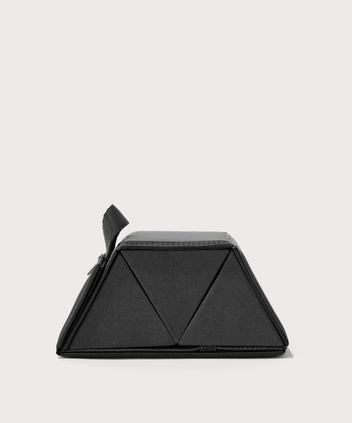 Dagne Dover Remi foldable glasses holder in black seen from the side.
