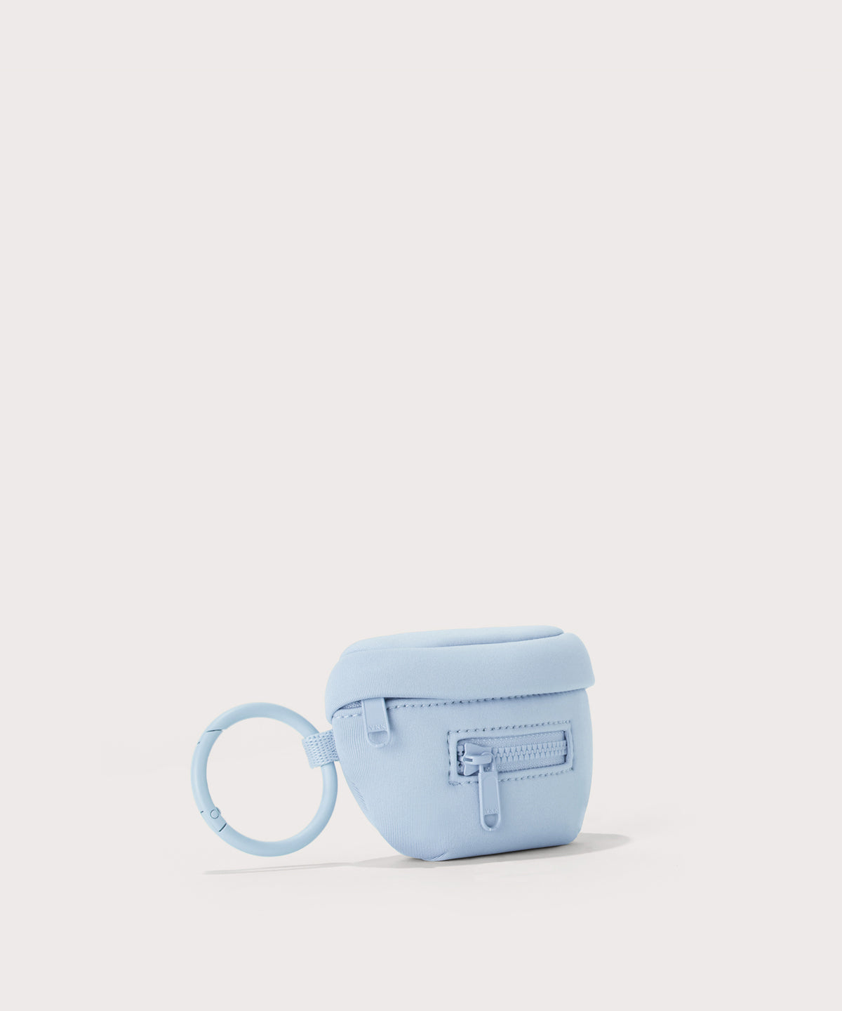 Dagne Dover Ace Keychain in an airy, lighter sky blue. seen from an angle.
