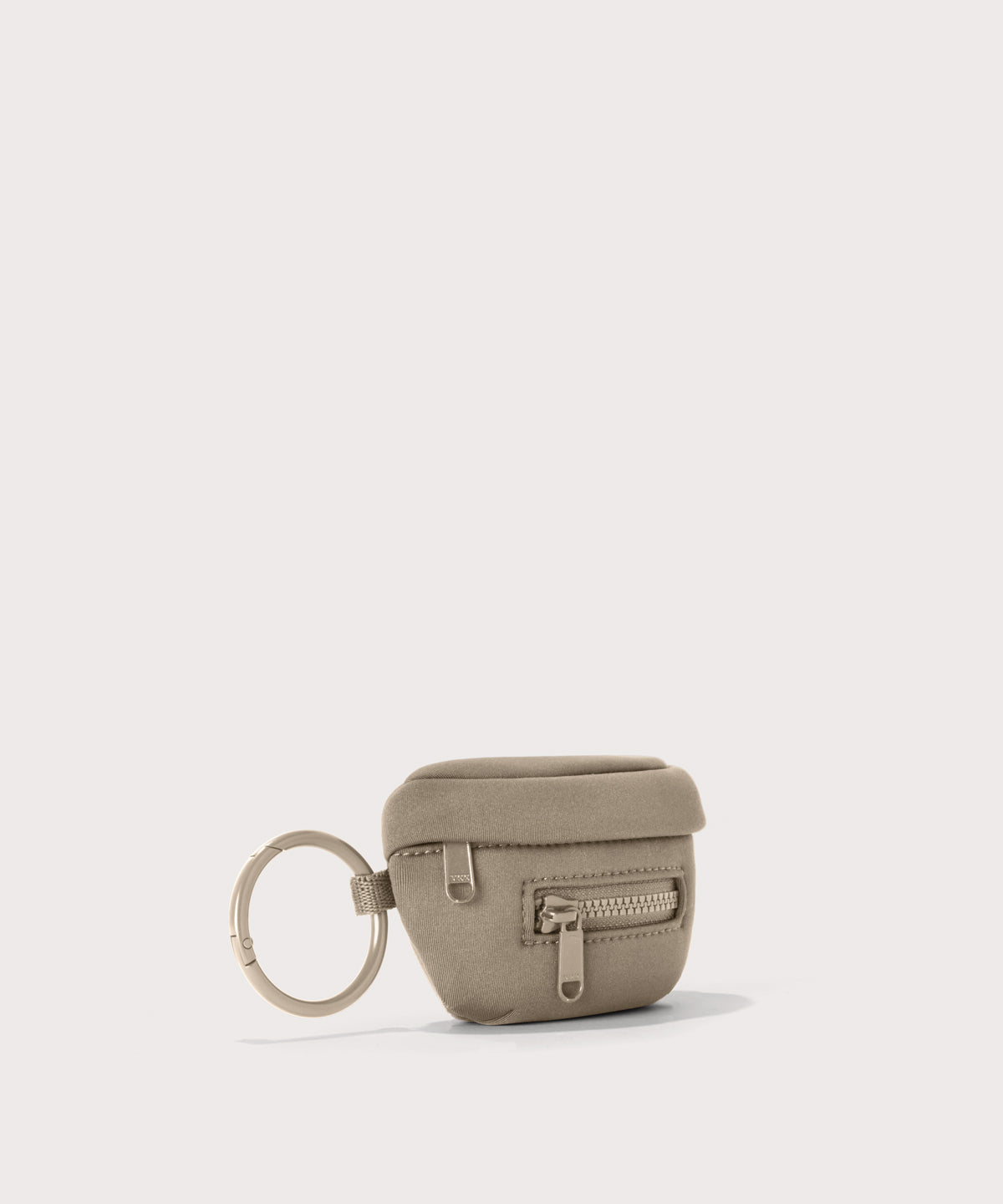 Dagne Dover Ace Keychain in a medium-dark, creamy tan seen from an angle.
