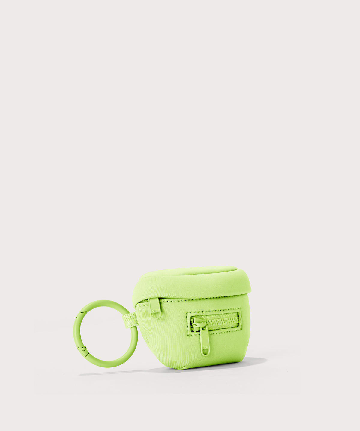 Dagne Dover Ace Keychain in vibrant, creamy green seen from an angle.
