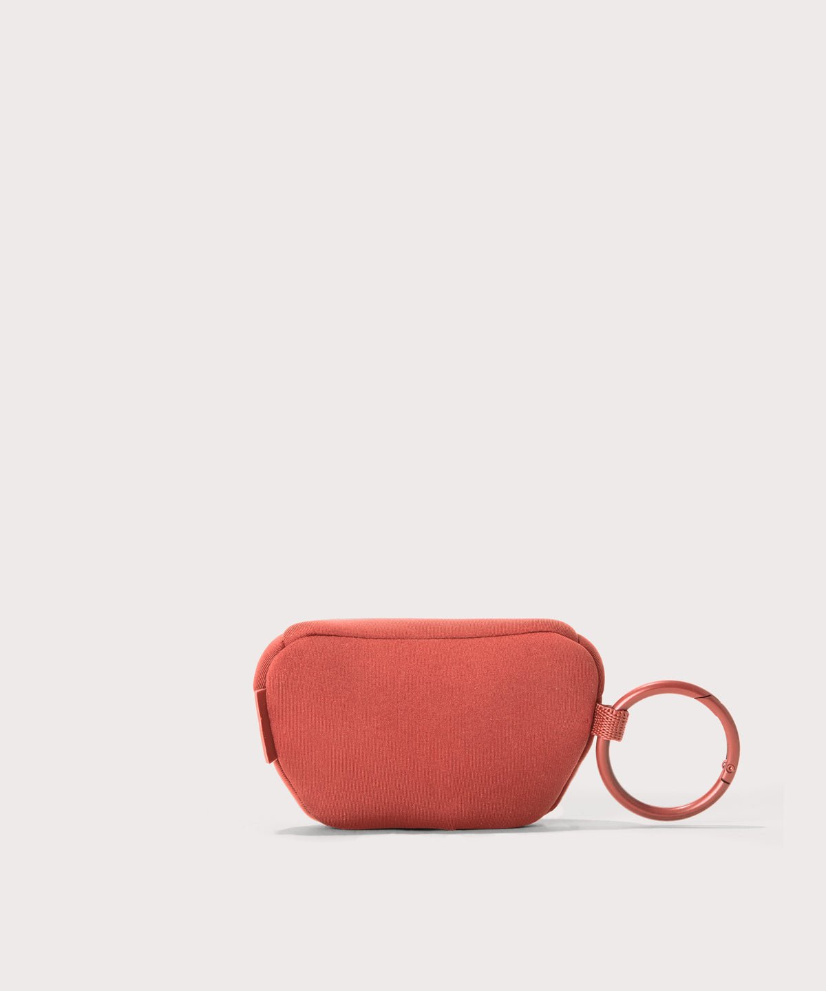 Dagne Dover Ace Keychain in a poppy, vintage wash red seen from the back.
