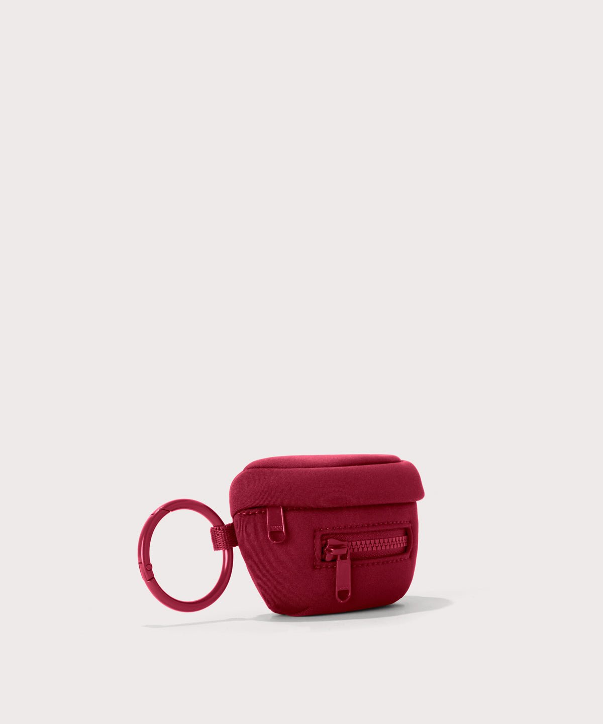 Dagne Dover Ace Keychain in a punchy, saturated deep red seen from an angle.
